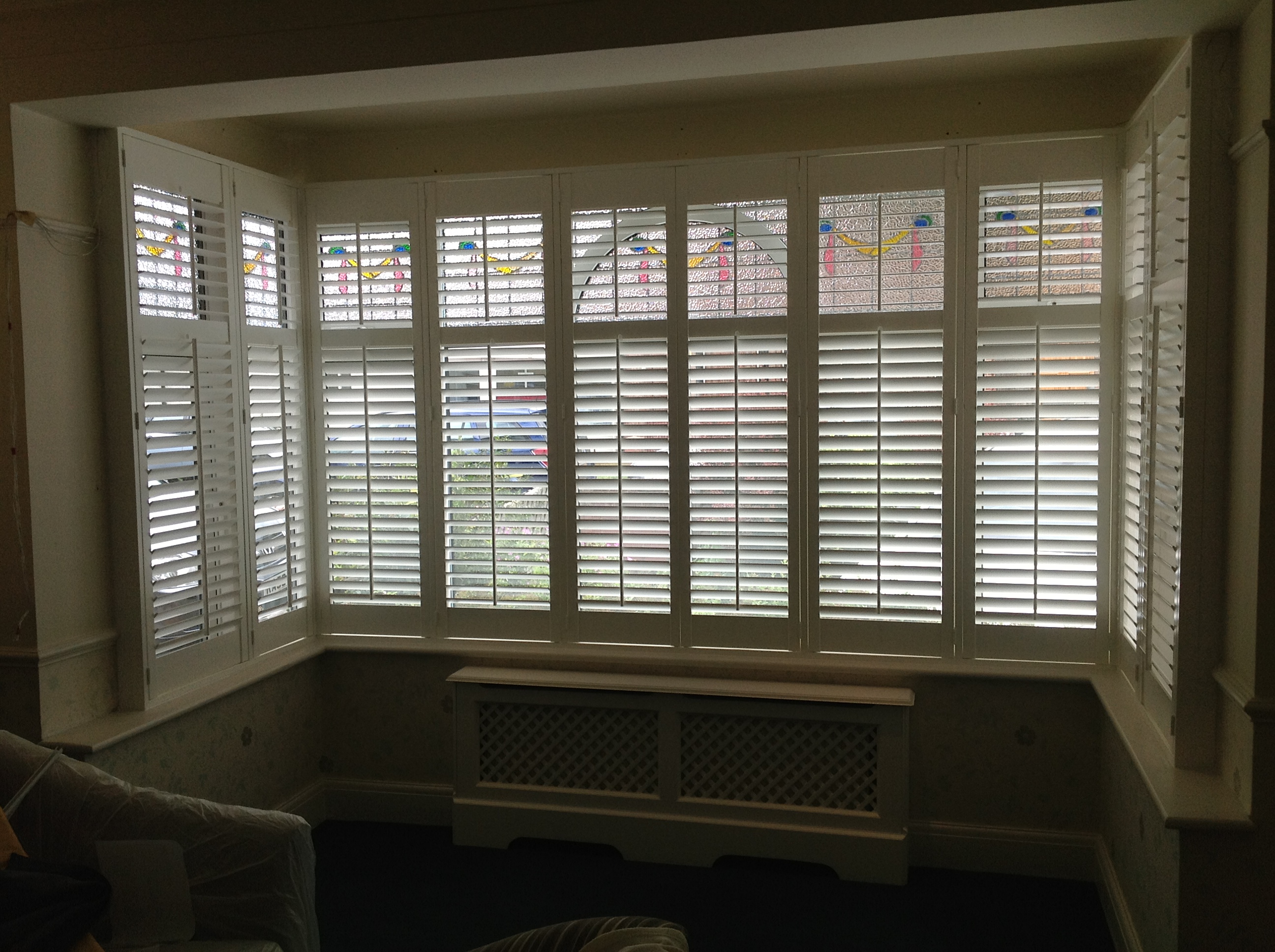 Living room bay window, 63mm louvres  - Plantation shutters -  Carolina Blinds