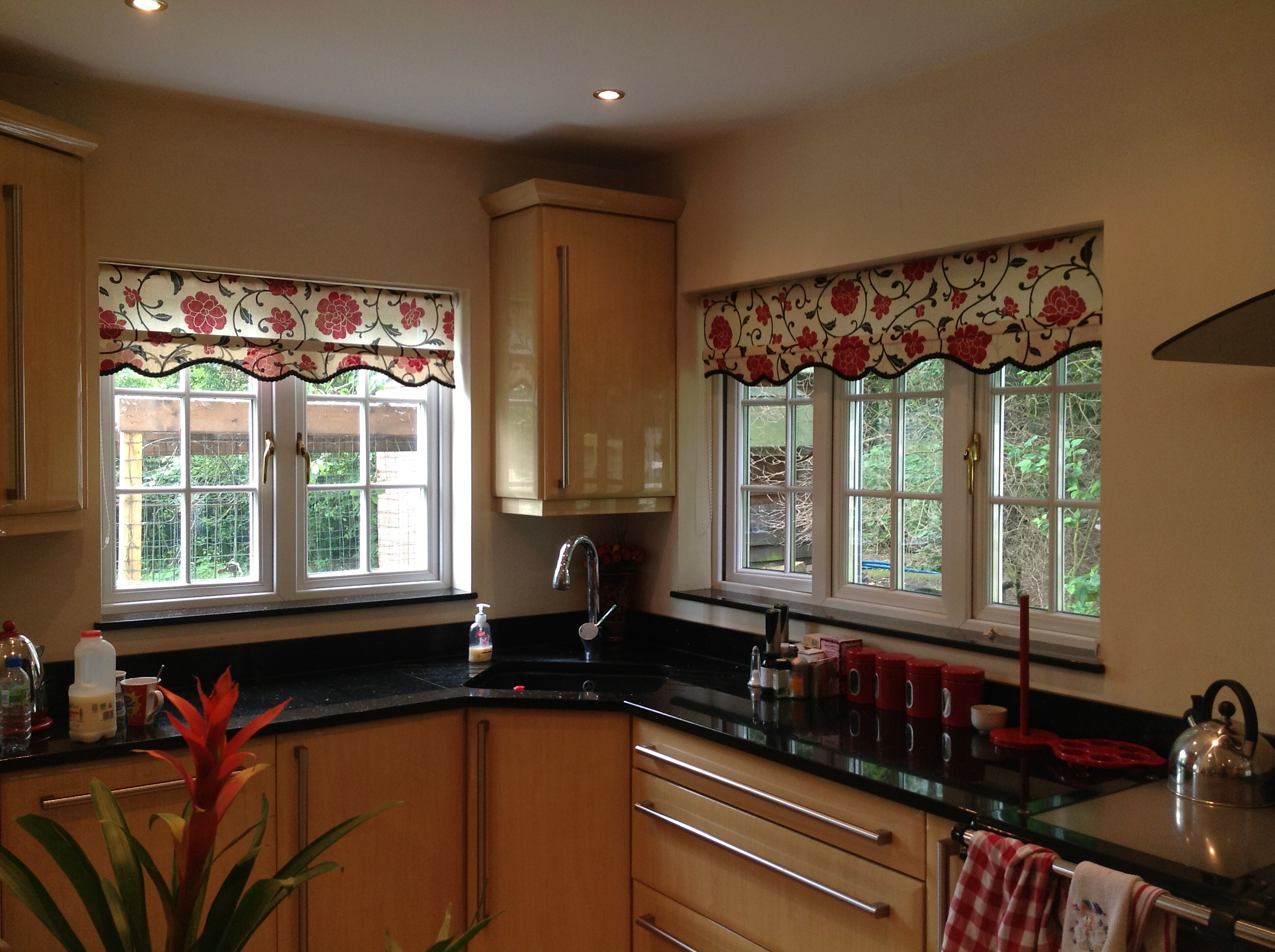 Rollers with shaped bottom and contrast braid dotted in kitchen, Much Hadham  - Roller blinds -  Carolina Blinds